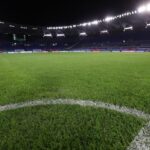 Campo dello Stadio Olimpico di Roma illuminato di notte.