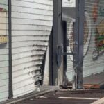 Serranda di un bar ad Acilia deformata e distrutta dopo l’esplosione di un ordigno nella notte.